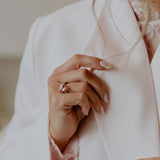 Morganite ring set with pave diamonds
