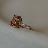 Morganite ring set with pave diamonds