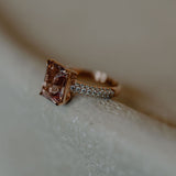 Morganite ring set with pave diamonds